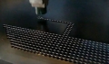 Dyna-star CNC-410 is punching a ship shape on the metal plate